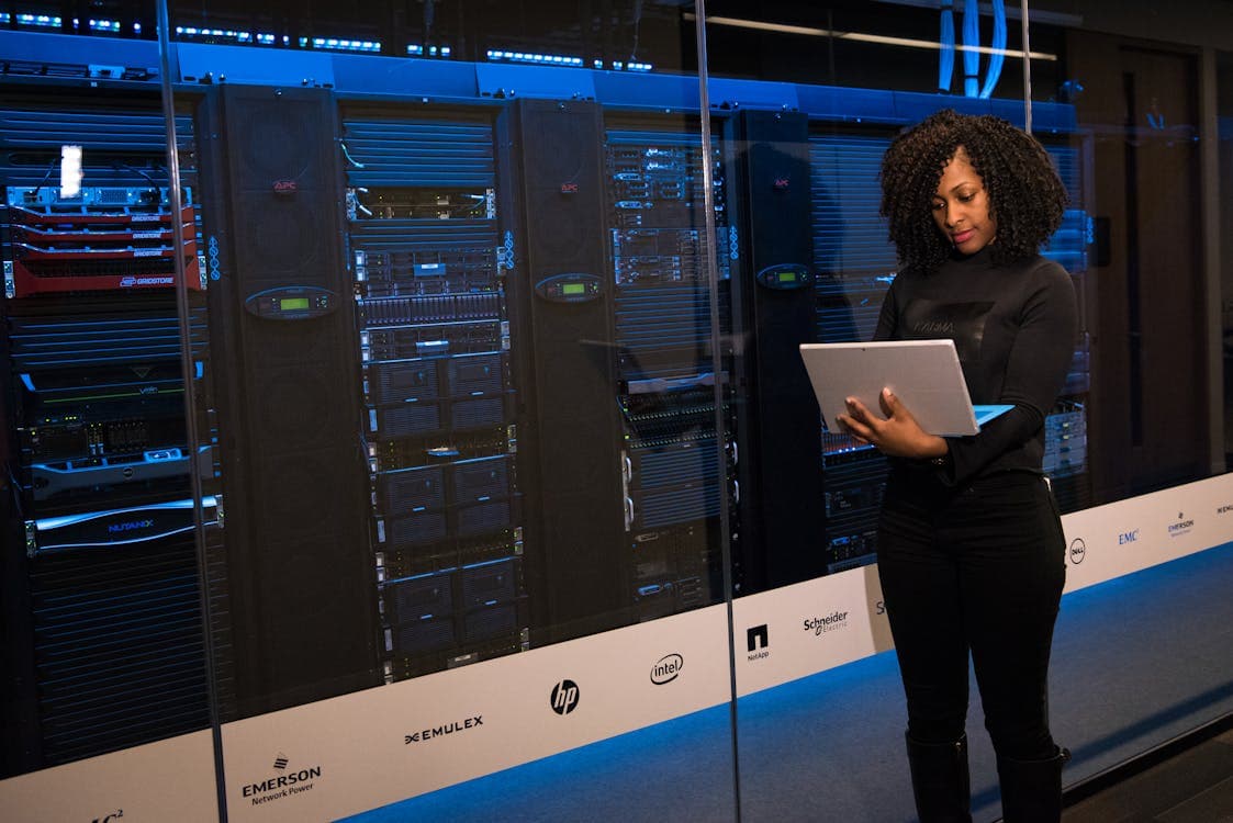 Engineer in server room with equipment